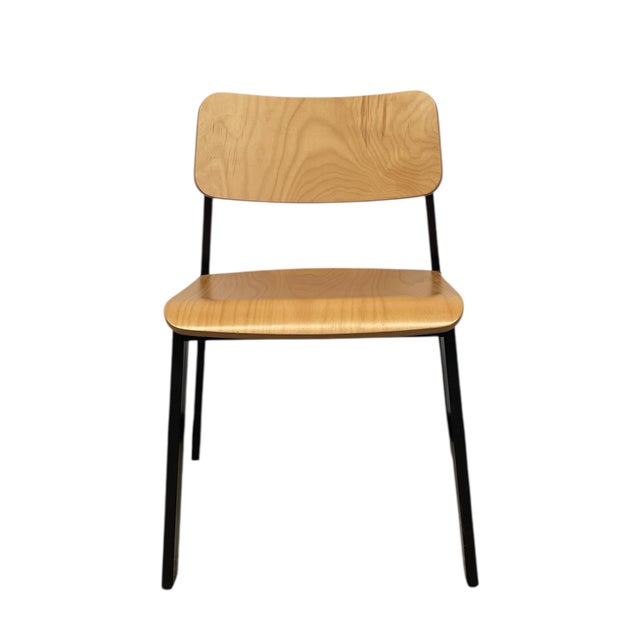 This vintage stacking chair combines utilitarian function with classic mid-century modern design. The seat and backrest...