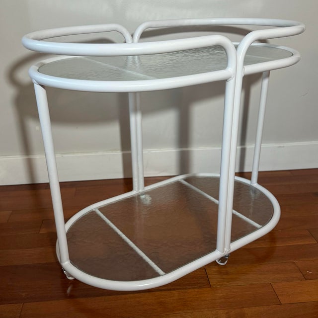 Amazing mid-century bar cart in the style of Brown Jordan. Would also make a fantastic plant stand.