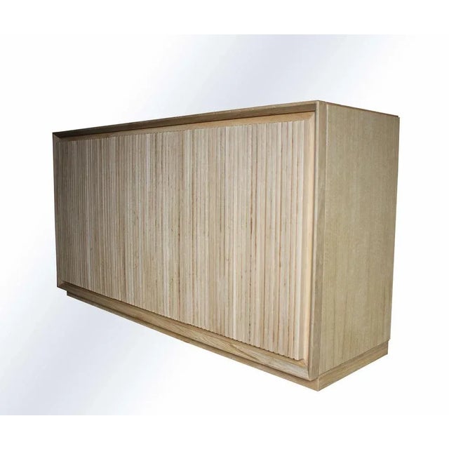 Mascia Meccani's "escape" belief for Meccani Design. Belief with three doors and two internal shelves. In oak. Labeled by...