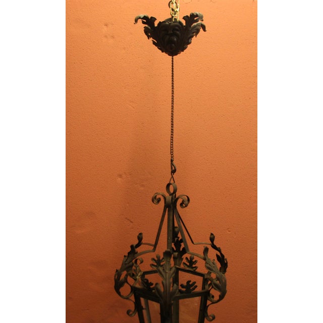 Beautiful 1920s wrought iron lantern from a French manor, decorated with acanthus leaf ornaments. A very rare feature: its...