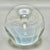 • This striking art glass paperweight features a mesmerizing iridescent interior with a precise controlled bubble design....