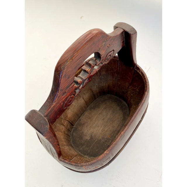 Beautifully patina on this Chinese antique wooden water bucket can be used to hold magazines, blankets or potted plants....