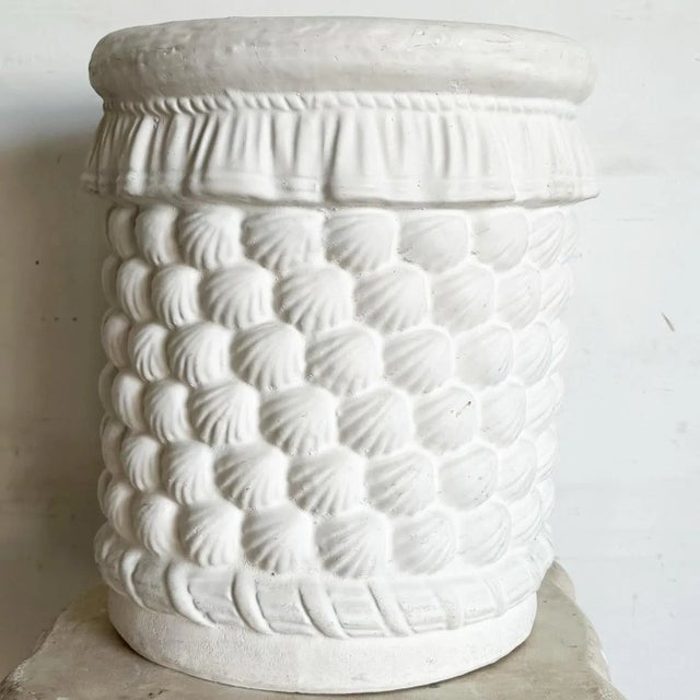 Bring the serene charm of the seaside to your home with the Coastal Cast Ceramic Sculpted Seashell Side Table/Pedestal....
