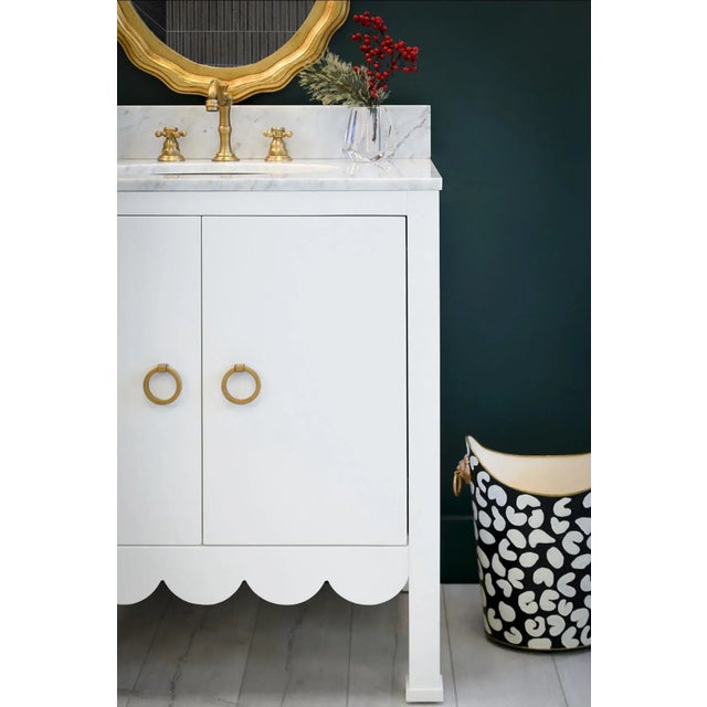 Embrace a sense of whimsy and sophistication with the Kealey WH bath vanity in a crisp matte white lacquer finish. Adorned...