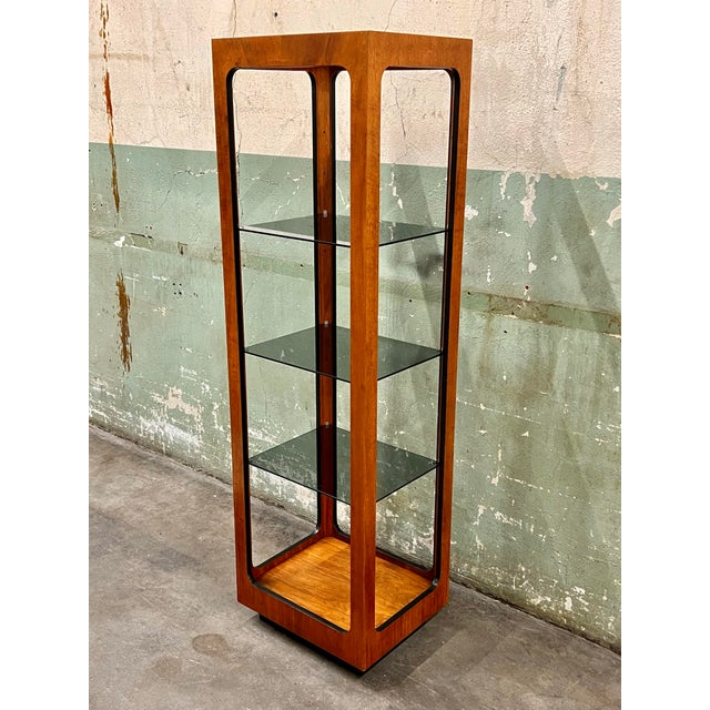 Vintage and rare narrow Lane display case with an open design and three adjustable smoked glass shelves, atop a recessed...