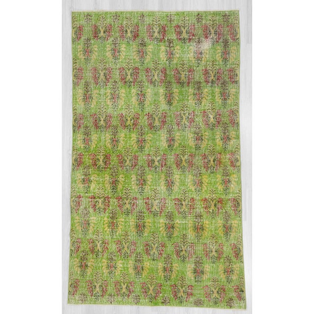 Hand-knotted vintage green rug from Isparta region of Turkey. Approximately 50-60 years old. In very good condition.