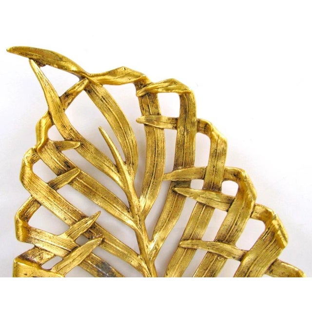 The Michael Aram Signed Large Gold Palm Leaf Centerpiece Platter is a stunning and elegant addition to any dining table or...