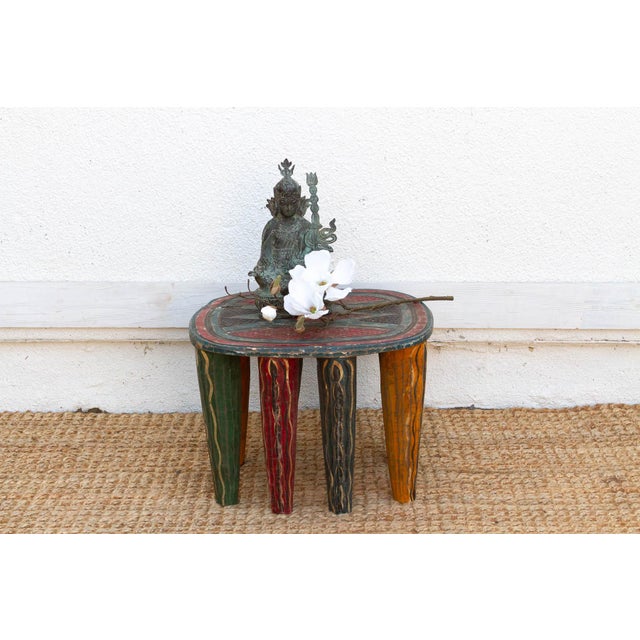 This vibrant 13-inch high table is a rare and exceptional example of the woodworking traditions of the Nupe people from...