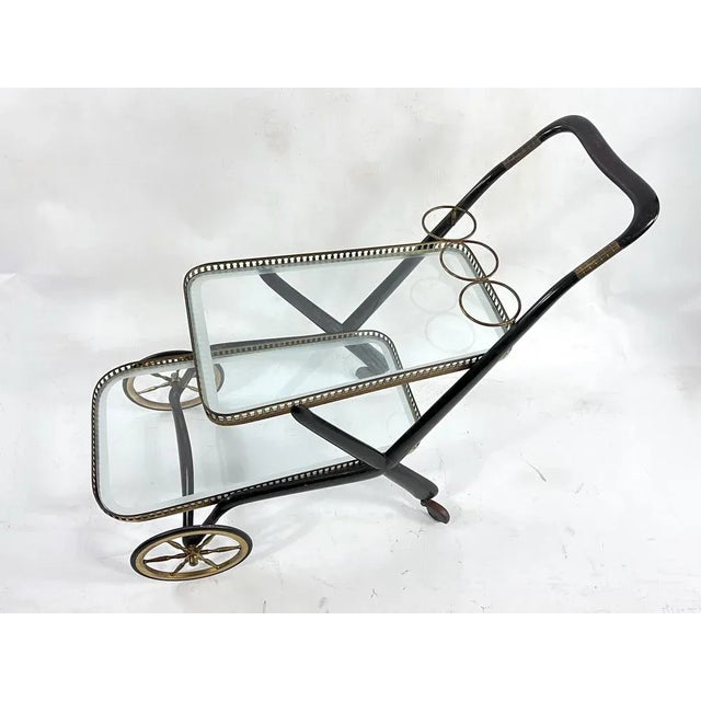 Original vintage condition with normal trace of age and use with patina on the brass for this Italian bar cart designed by...