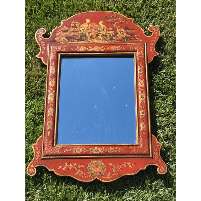 Charming petite scale red Chinoiserie wooden mirror inspired by 18th century English Georgian decorative arts. Perfect...