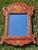 Charming petite scale red Chinoiserie wooden mirror inspired by 18th century English Georgian decorative arts. Perfect...