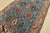 An authentic vintage tribal Heriz rug hand-knotted with fine wool on a cotton foundation. This rug features geometric...