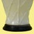 A single white table lamp with a faux-bamboo base, bringing fresh coastal character to a bedside or console. The crisp...