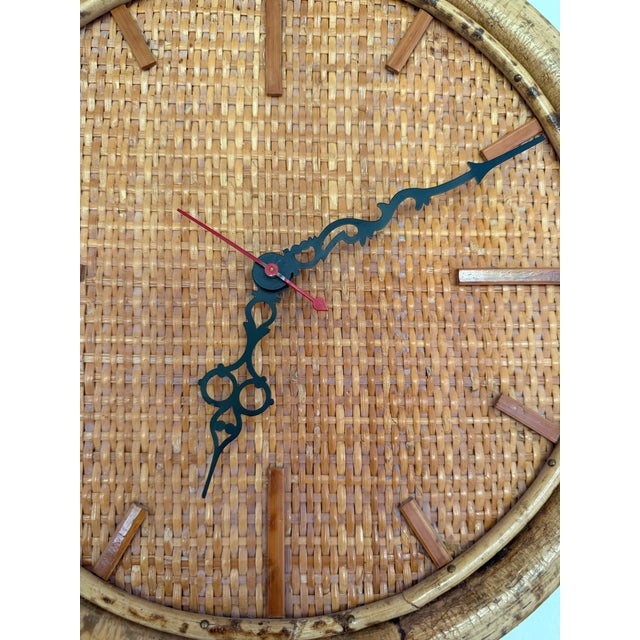 Vintage rattan and bamboo wrapped wall clock. Pretty tortoise coloring to the rattan. Nice large size. Works great. All...