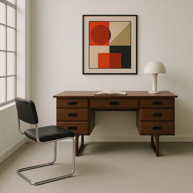 This Mid Century Desk with a Laminate Top is a beautifully designed piece that combines vintage charm with modern...