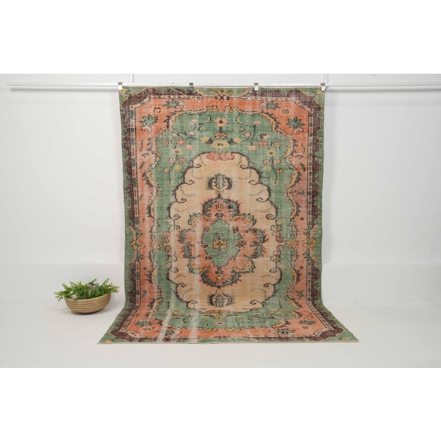 Vintage Hand-Knotted runner rug is a semi-antique vintage area rug. The '70s Eastern region of Anatolia's unique rug is...