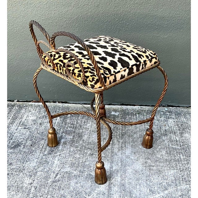 This whimsical Hollywood Regency vanity stool is a masterclass in playful elegance, blending sculptural form with a bold...