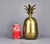 This beautiful pineapple jar is made from solid brass. This one stands 11 1/2" tall, which is perfect to hold ice cubes...