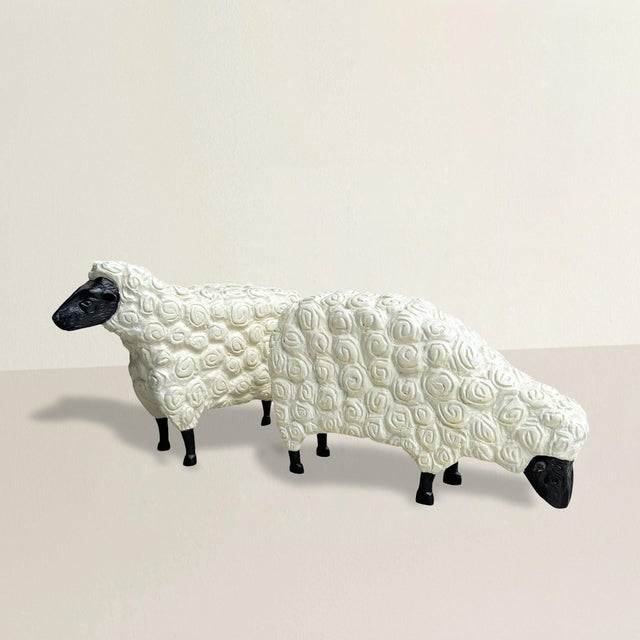 These two hand-carved sheep by Stephen Huneck capture everything that makes his work so beloved: warmth, whimsy, and an...