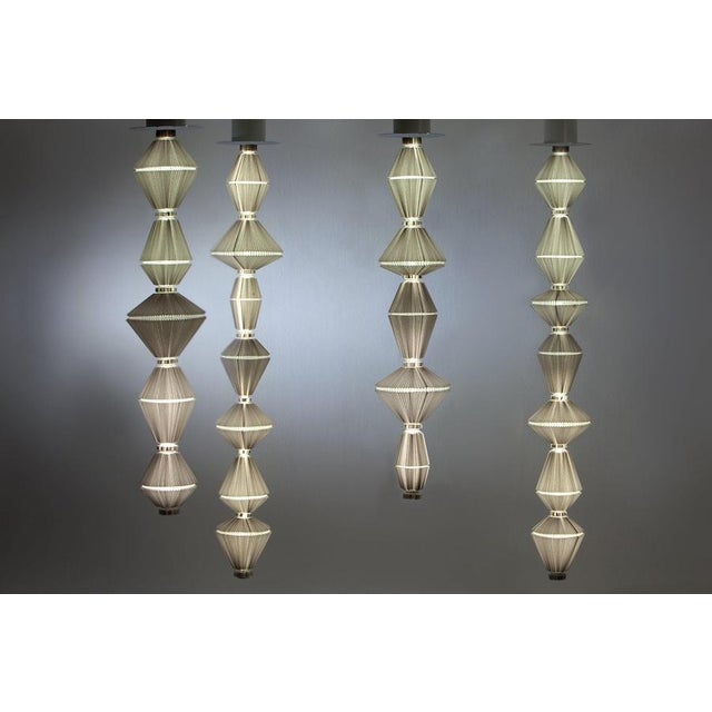 Set of four oiphorique suspension lamps designed by atelier oi in 2014. manufactured by parachilna (spain) 2x oiphorique t...