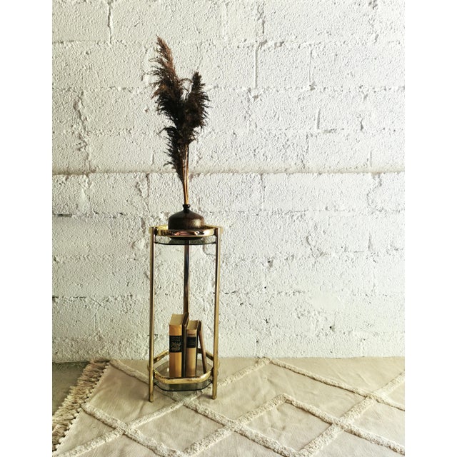 This stunning, narrow, and tall side table was crafted in the 1970s and perfectly captures the slightly decadent spirit of...