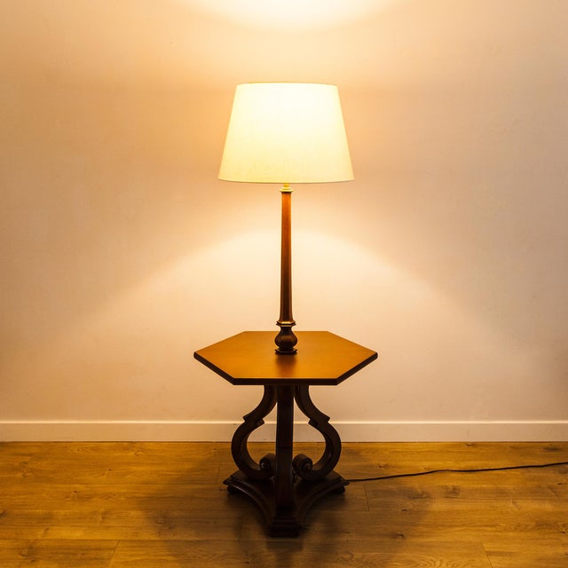 Restored 1960s provincial floor lamp with built-in cocktail table, made by Tomlinson in the United States. The hexagonal...