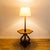 Restored 1960s provincial floor lamp with built-in cocktail table, made by Tomlinson in the United States. The hexagonal...