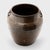 Coated inside and out with a rich drip glaze, this early 20th-century jar was originally used for storing foods and...