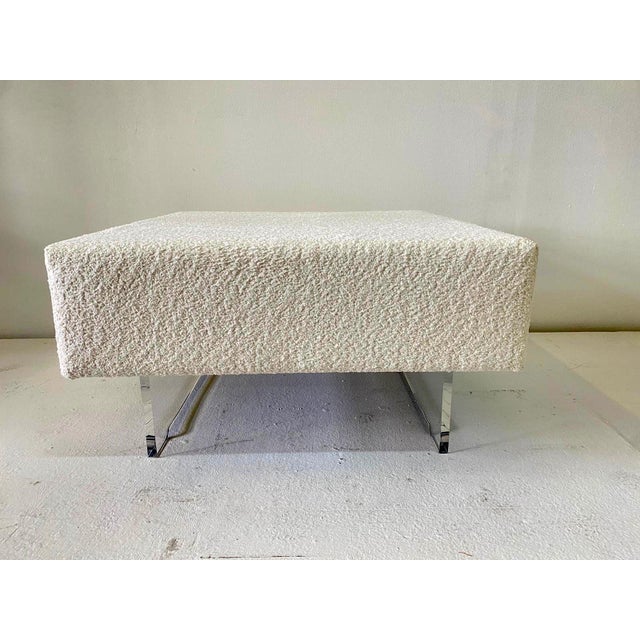 Simple and classic design for this square ottoman in fresh boucle fabric and on two lucite legs. Clean and perfect for any...