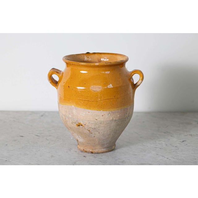This charming 19th-century Spanish terracotta pottery jar showcases the rustic elegance of traditional ceramic...
