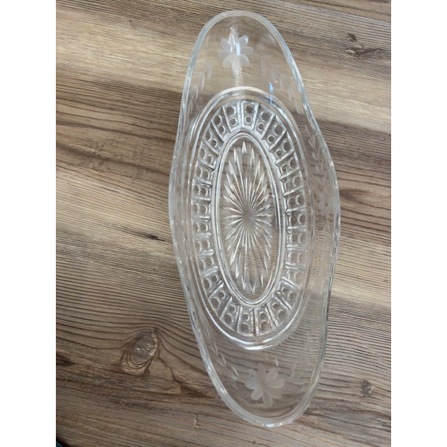 Similar pressed-glass and crystal oblong serving or celery dishes were produced by mid-century and antique manufacturers...