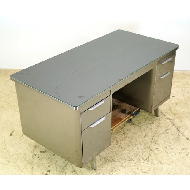 Vintage Industrial style office desk with five drawers and two pull out tops. The desk features a clear glass top. Good...