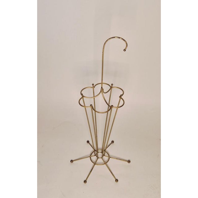 Midcentury Modern umbrella stand, decorative and functional. Thin metal with golden color finish. Nice patina, normal...