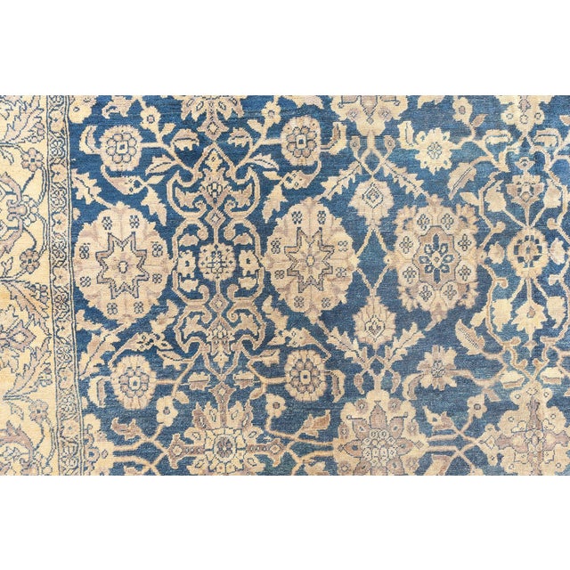A finely hand-knotted wool antique Persian Sultanabad rug dating back to circa 1920. The design consists of a grid of...