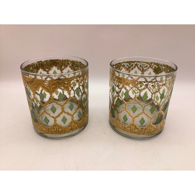 Culver Valencia 22kt gold and green diamond cocktail glass set of 2. The glasses show wear including minor scratches,...