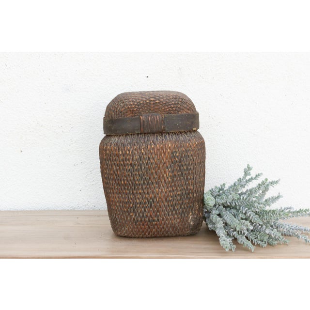 Discover the honest beauty of traditional hand-craftsmanship with this magnificent antique lidded basket. Measuring...
