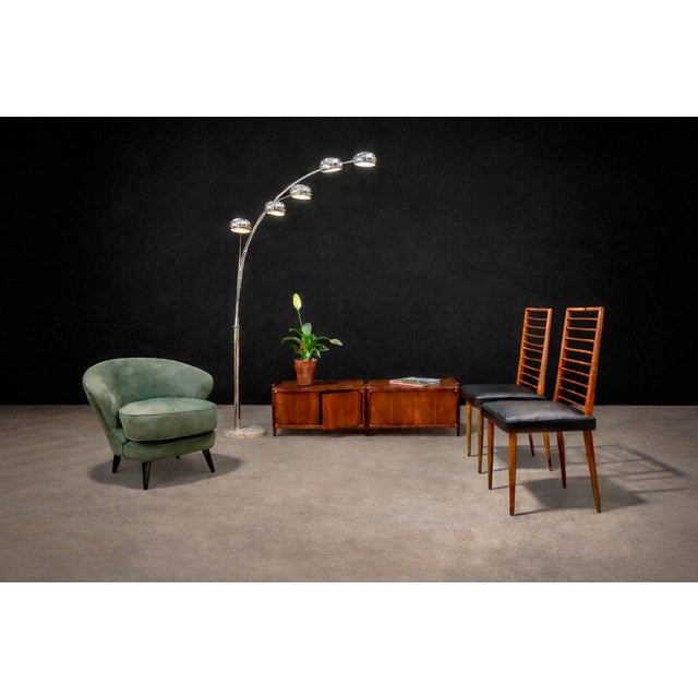 Designed by Joaquim Tenreiro (1906–1992), these dining chairs exemplify the designer’s pioneering role in shaping...