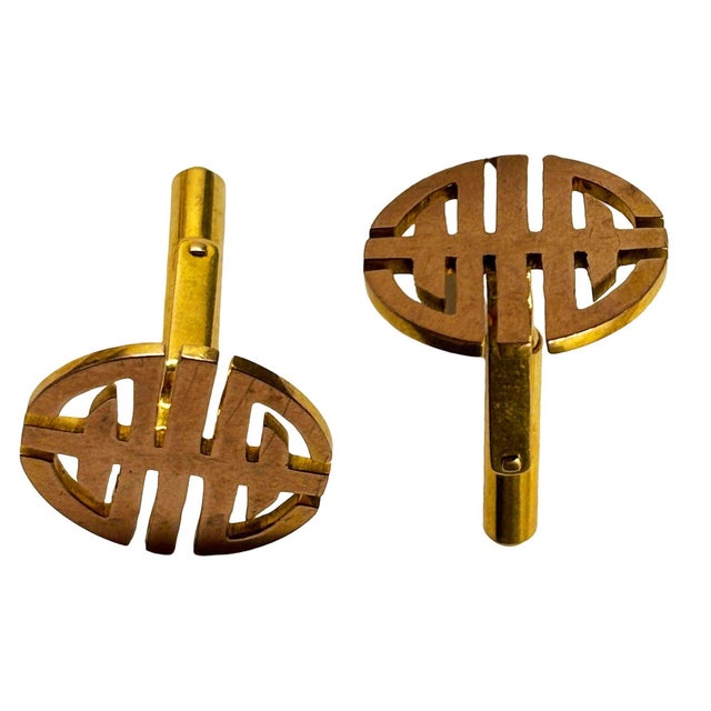 A pair of vintage 14Kt yellow gold circular cuff-links cut out with the Chinese character symbol for longevity....