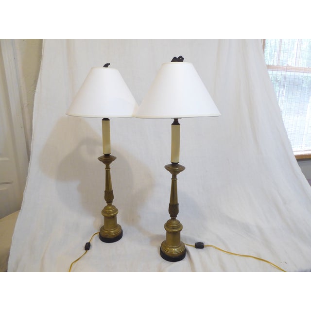 This pair of early 20th Century French brass lamps have updated wiring and use up to 100 watt Edison base bulbs. They are...
