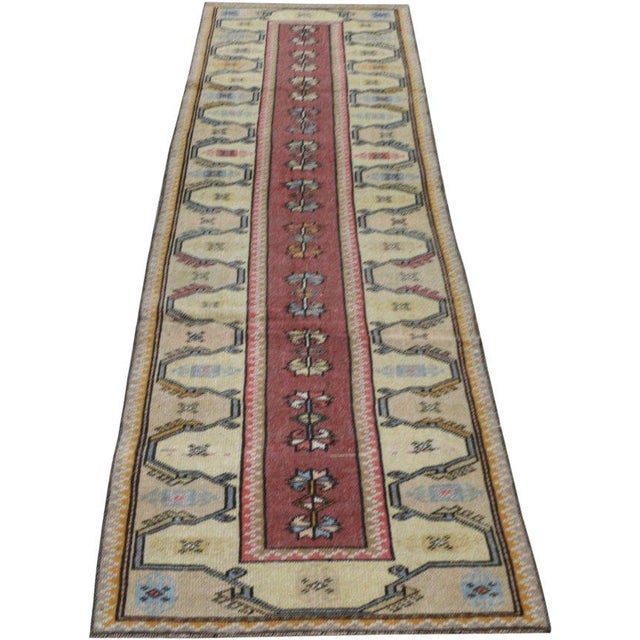 Hand-knotted with care using traditional rug-making techniques, this wool rug blends timeless craftsmanship with a modern...