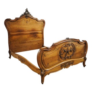 Antique French Louis XV–Style Carved Walnut Bed With Floral Rocaille Details For Sale