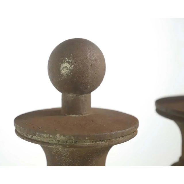 Heavily rusted carved cast iron newel posts with an attached bolt plate on the bottoms. There is expected wear. This is...