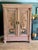 A beautiful antique French wardrobe, reworked with four hand-painted chinoiserie panels—black swans, birds and...