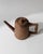 This vintage wooden pitcher from the 1960s is a beautifully hand-carved example of rustic folk art craftsmanship. Its...