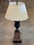 Pair of bronze and marble urn lamps. Each is formed as a classical campana urn in dark patinated bronze, the body cast in...