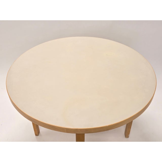 Artek table model 90A, birch with cream linoleum. Some signs of wear. Designer Alvar Aalto. The table is from around...