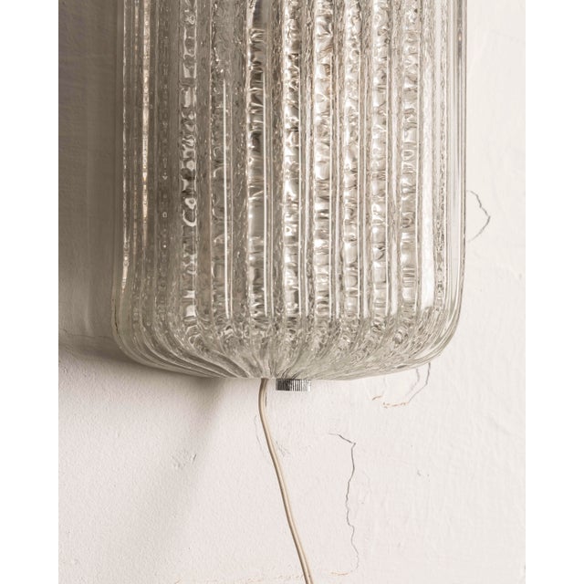Impressive XL wall sconce made of Murano glass, Italy, 1960s–70s. The piece stands out for its large size, 65 cm high, and...