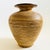 A mid century West German Pottery vase. Nice large size with earth tone glazes and a carved textured striated design...