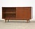 A mid century modern teak sideboard credenza with two sliding doors designed by Ib Kofod Larsen for Selig. Unmarked....