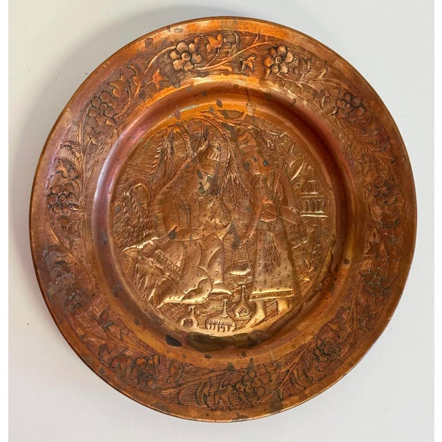 Vintage Middle Eastern engraved copper catchall trinket dish or display plate with deep rim. Marked Iran on underside....